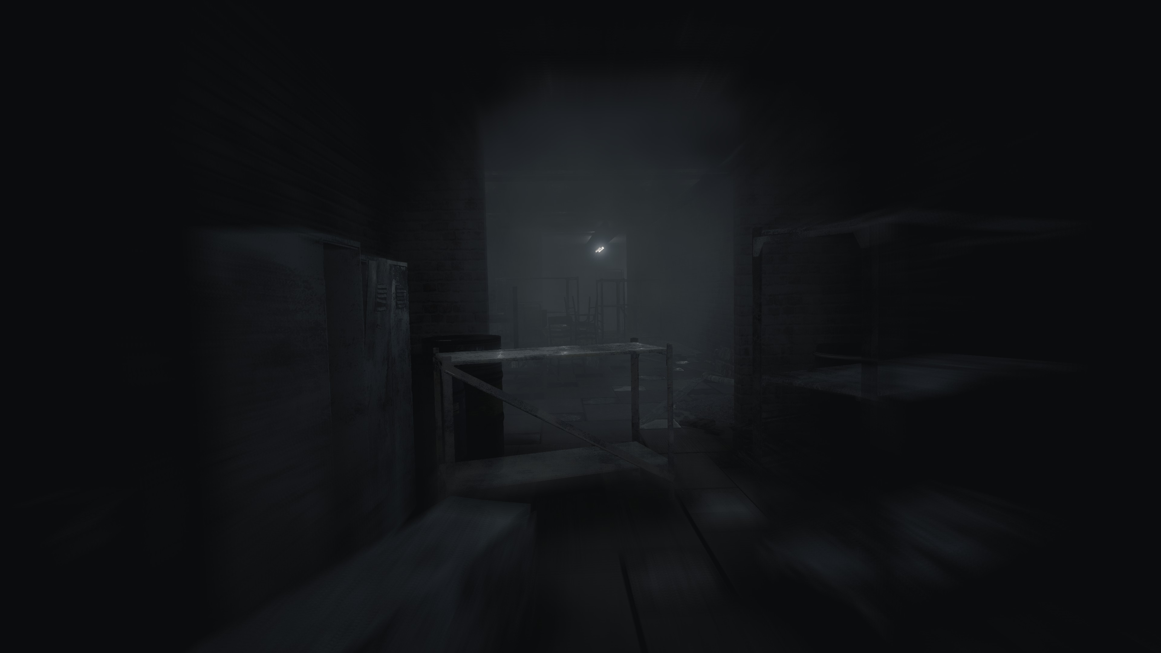 A dark hallway cluttered with bent metal shelves and lockers.